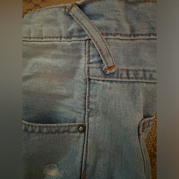 Free People distressed medium wash denim button fly cuffed shorts. 25 - Picture 11 of 12